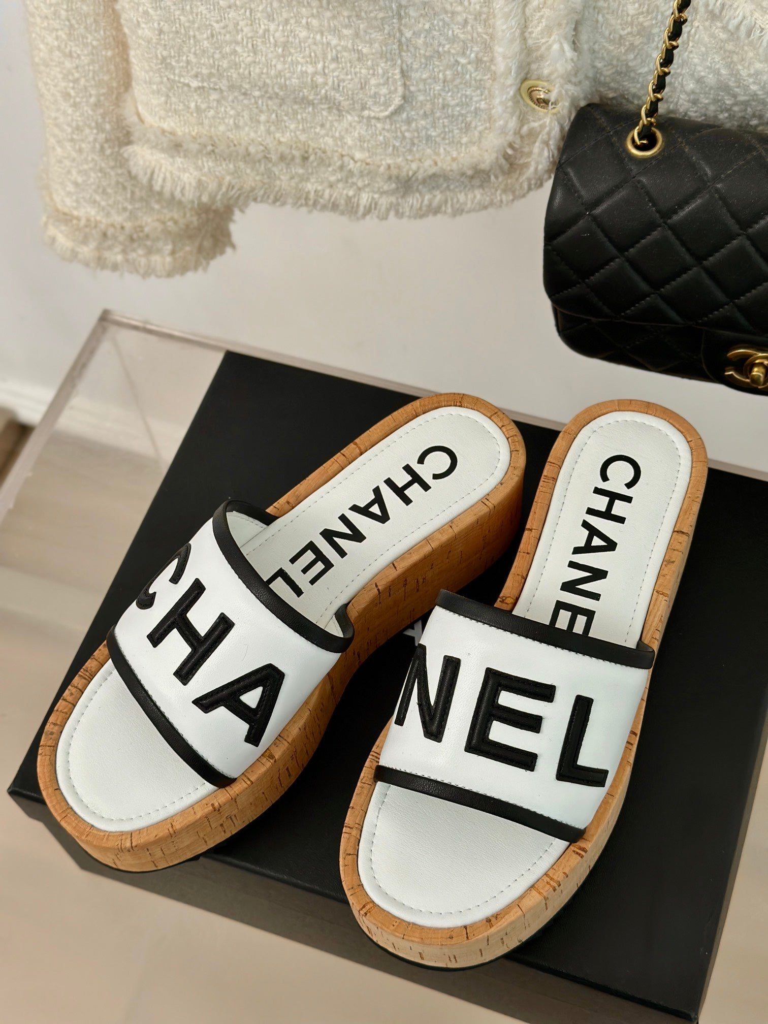 CHANEL THICK SOLE LETTER SLIPPERS IN WHITE SHEEPSKIN
